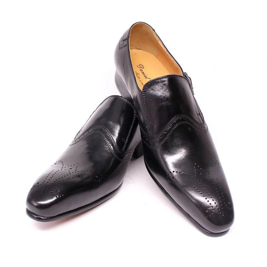 Black leather pointed toe men's dress shoes with brogue detailing on white background