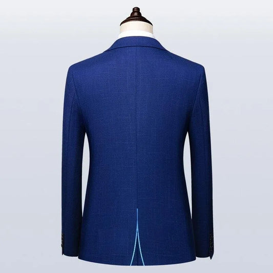 Back view of blue men's suit jacket on mannequin, classic modern design