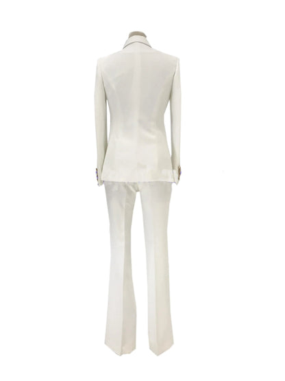 Back view of white double-breasted bell bottom pantsuit on mannequin