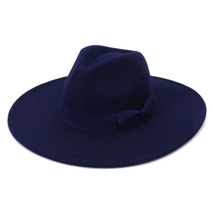 Wide brim navy blue retro fedora hat with ribbon band on white background