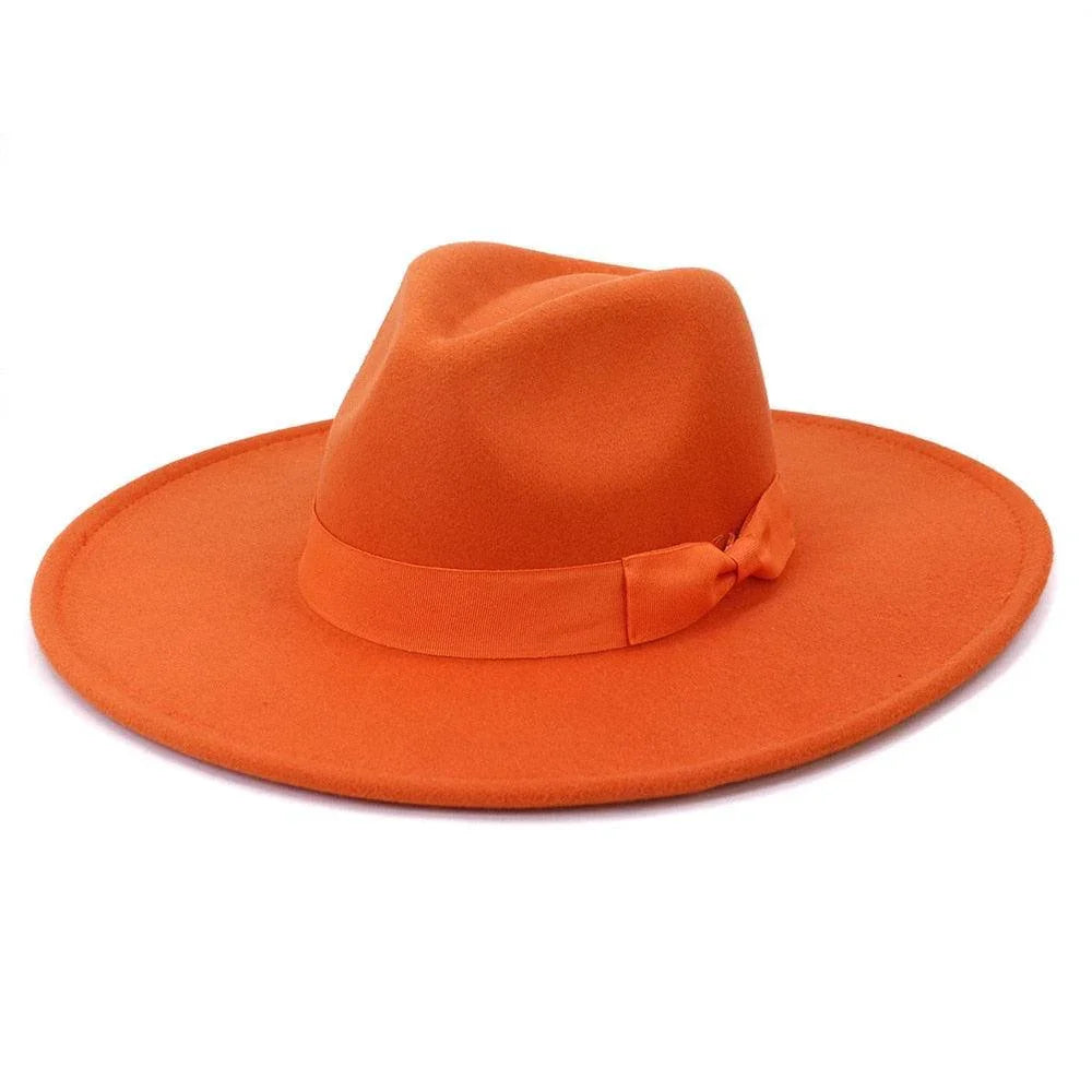 Bright orange wide-brim retro fedora hat with ribbon detail on a white background