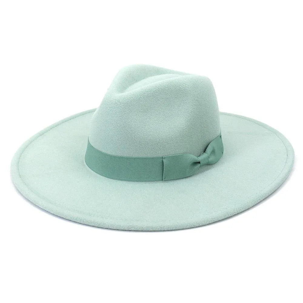 Light green retro fedora hat with wide brim and matching ribbon on white background