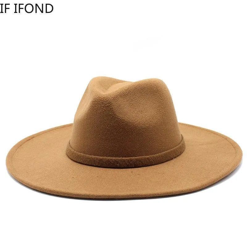 Classic brown British style fedora hat with wide brim on white background