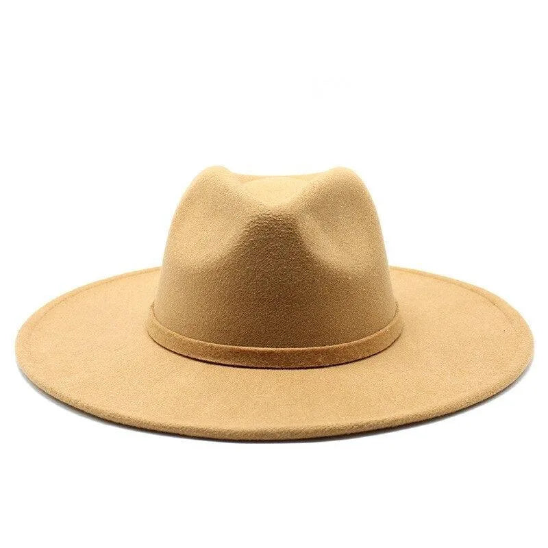 Tan British style fedora hat with wide brim on white background