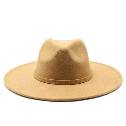 Tan British style fedora hat with wide brim on white background