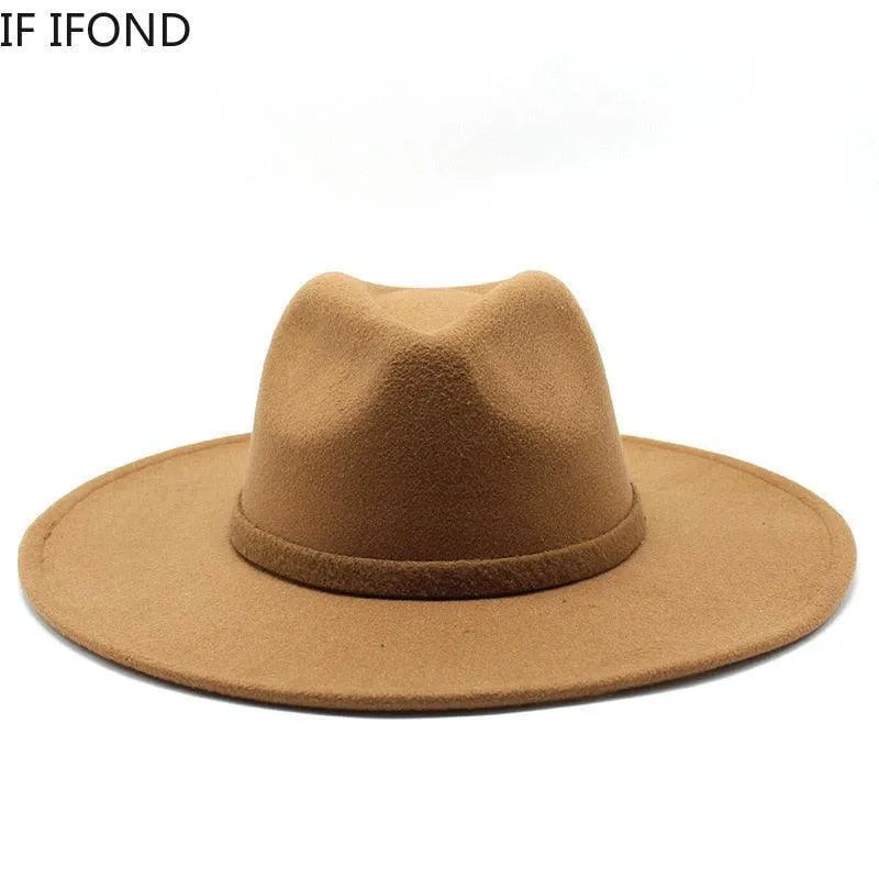 Classic British style tan fedora hat with wide brim on white background