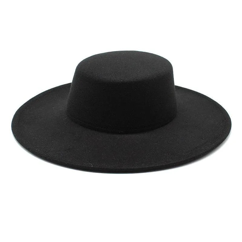 Black derby fedora hat with wide flat brim on white background