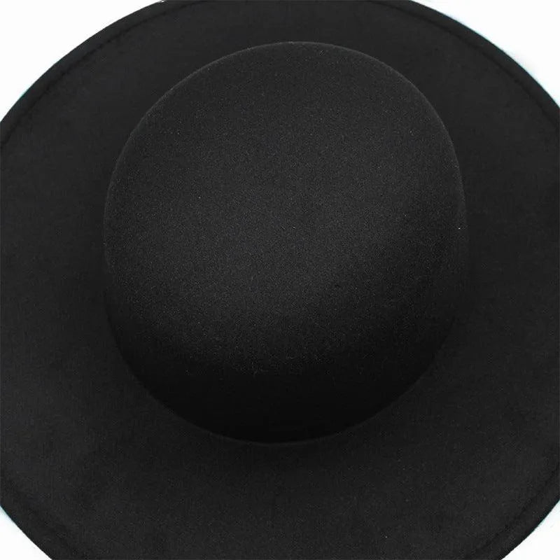 Black derby fedora hat with wide brim on white background