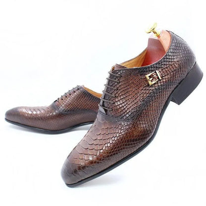 Brown python-patterned men's dress shoes with laces and gold buckle on white background