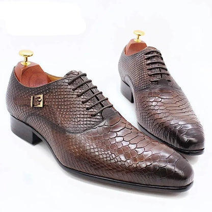 Brown men's dress shoes with lizard skin pattern on white background