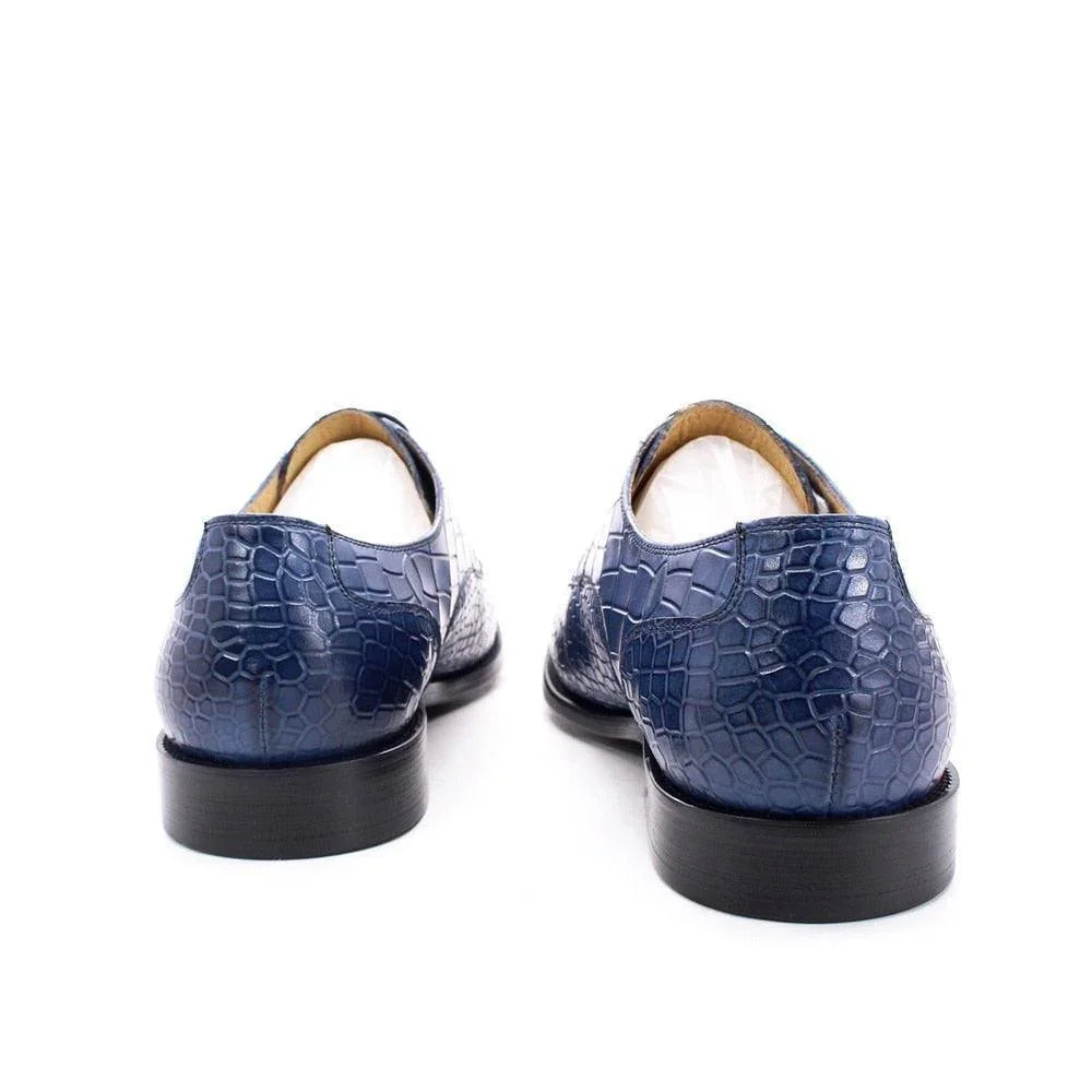Back view of blue crocodile pattern leather men's dress shoes on white background