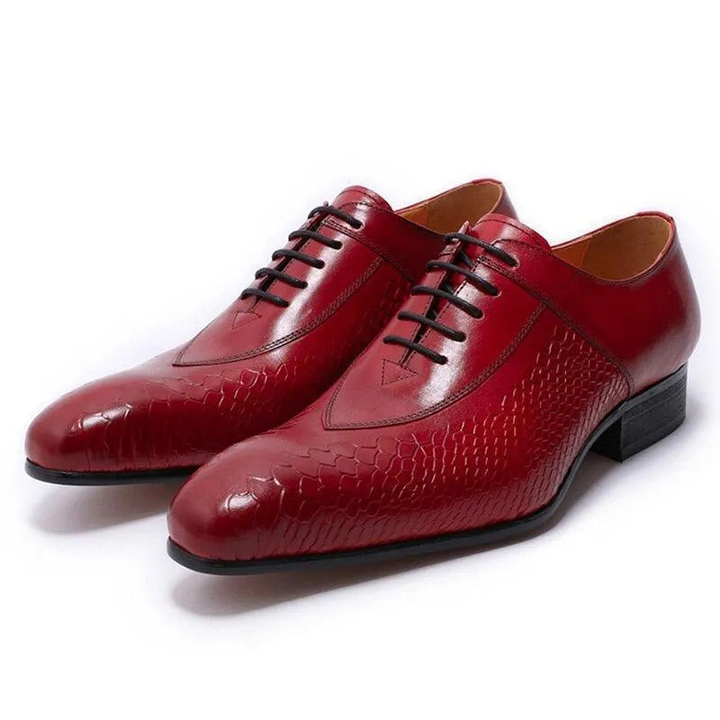 Men's red textured leather dress shoes with black laces on a white background