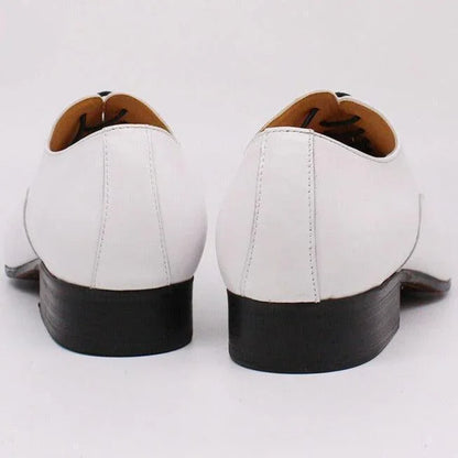 Back view of white leather men's dress shoes with black heels on white background