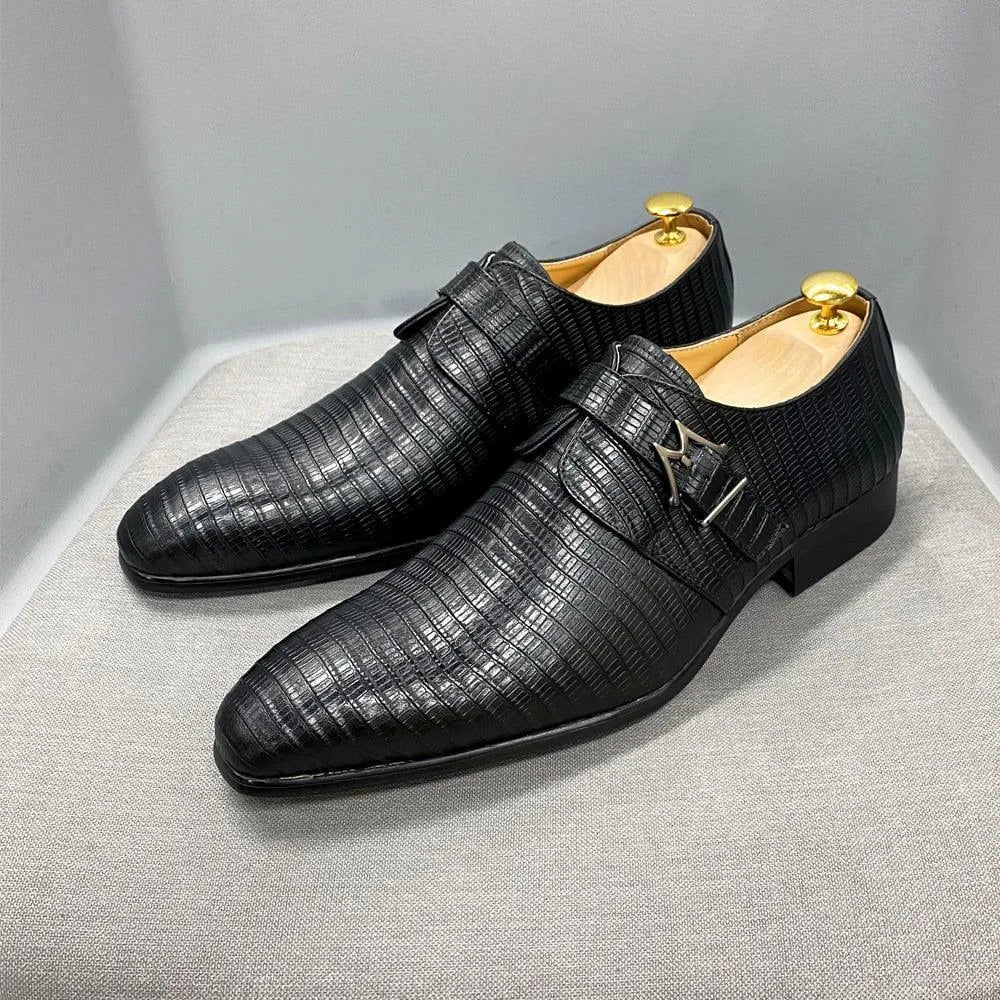 Black textured leather men’s dress shoes with side buckle on display