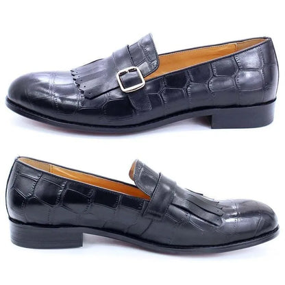 Black leather men's dress shoes with fringe, buckle, and crocodile texture