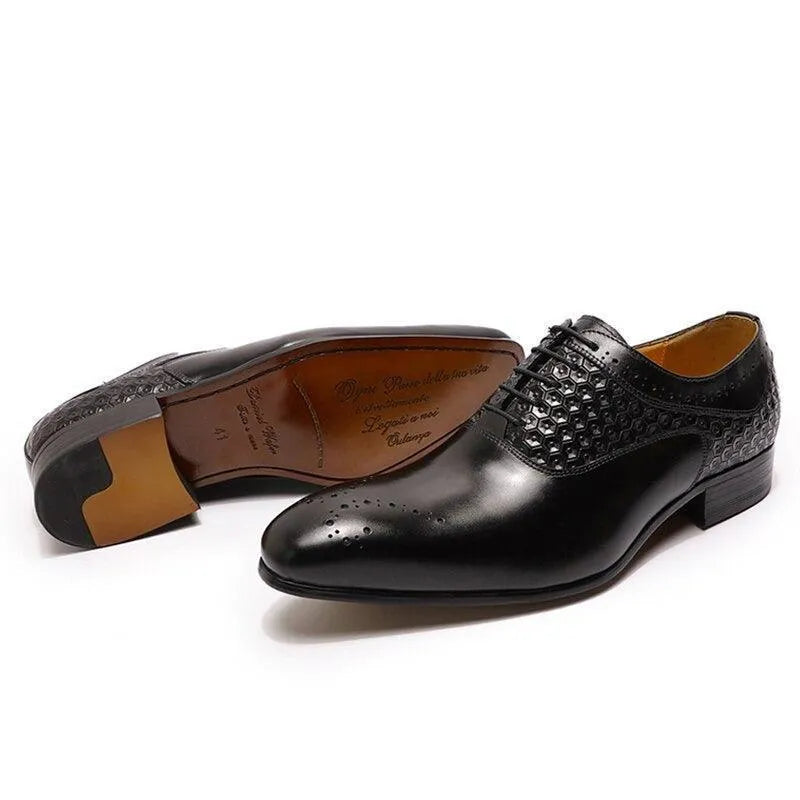 Glossy black men's dress shoes with textured leather and lace-up design on white background