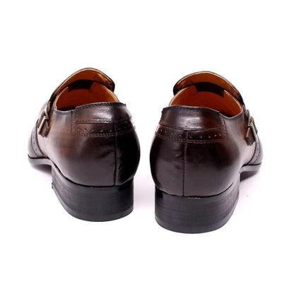 Rear view of brown leather men's dress shoes with buckle detail on white background