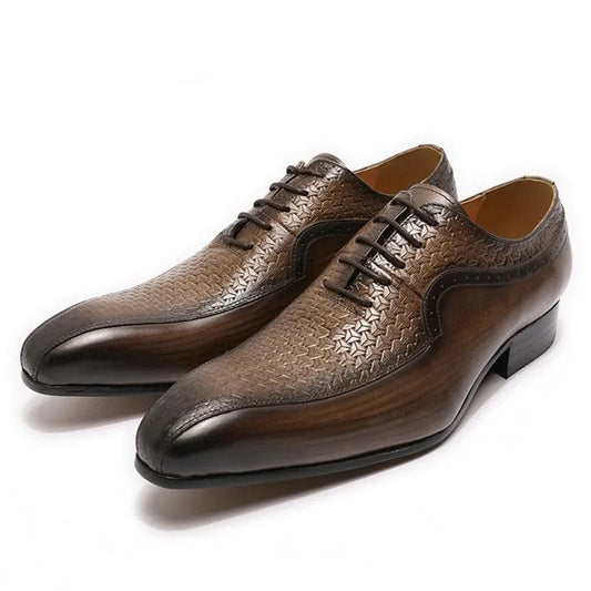 Brown pointed toe men's dress shoes with textured pattern and black laces on white background