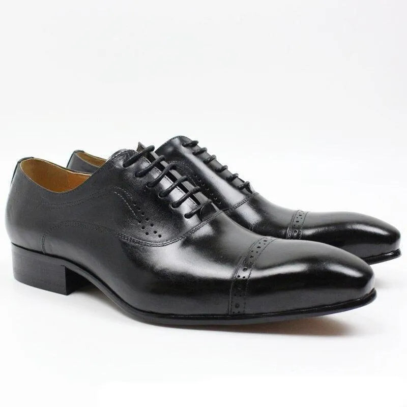 Black leather men's lace-up dress shoes with cap toe design on white background