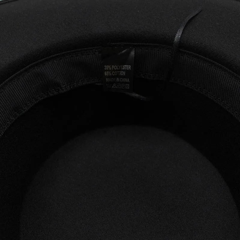 Closeup inside black fedora hat showing fabric label with polyester and cotton blend