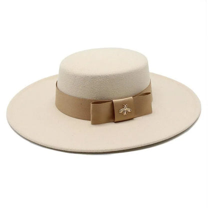 Beige flat top fedora hat for women with brown bowknot and gold bee brooch