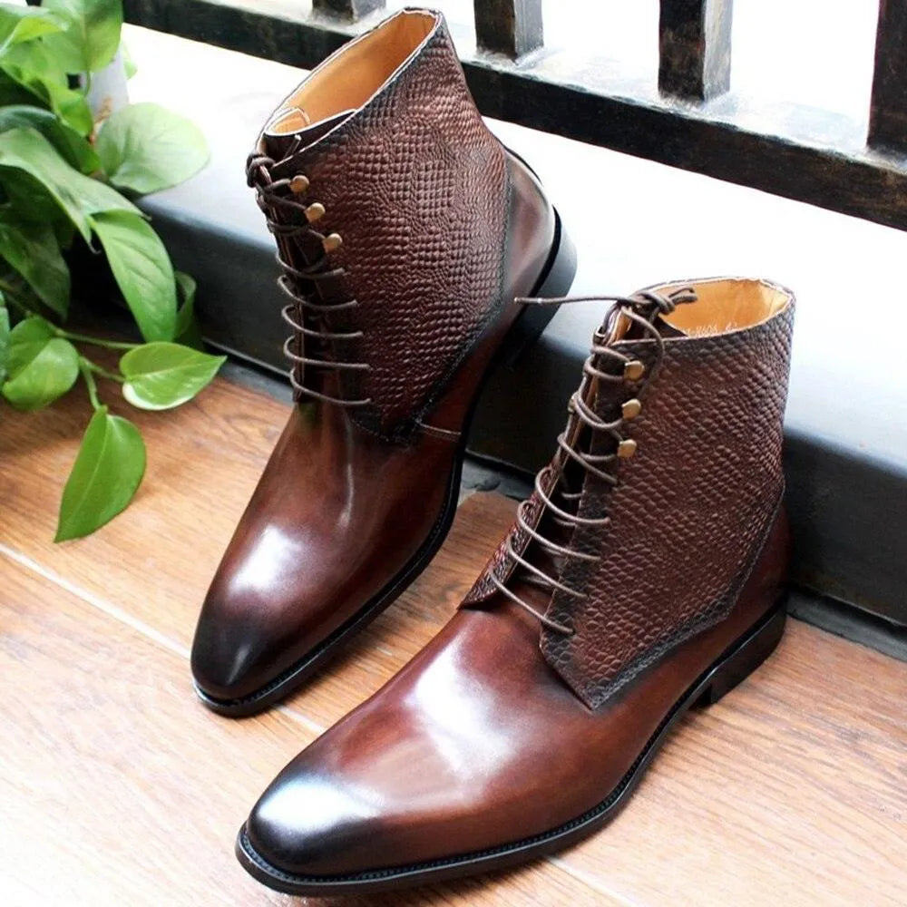 Men's brown leather ankle boots with textured sides on wooden floor by green plant