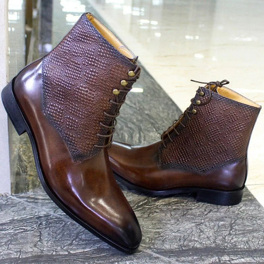 Men's brown leather ankle boots with textured pattern, lace-up design on marble floor