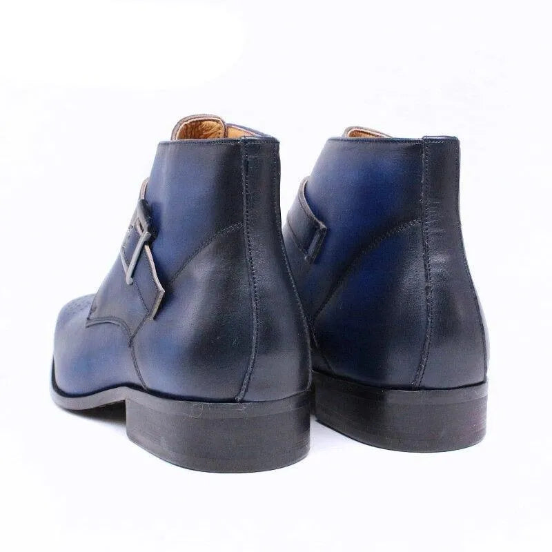 Men's navy blue leather ankle dress boots with buckle detail on white background