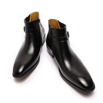 Black leather ankle boots with side zippers on a white background