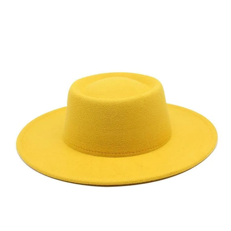 Bright yellow fedora hat with flat brim on white background