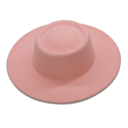 Light pink fedora hat with wide brim on a white background
