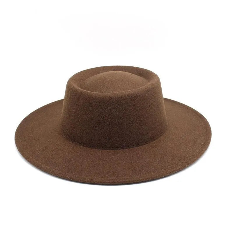 Brown felt fedora hat with wide brim on white background