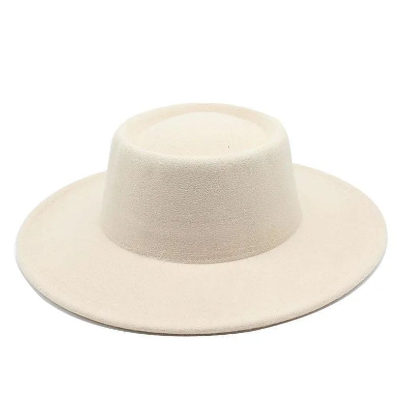 Beige wide-brim fedora hat with flat crown on white background