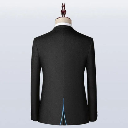 Back view of a black men's suit jacket on mannequin, classic slim fit tuxedo style