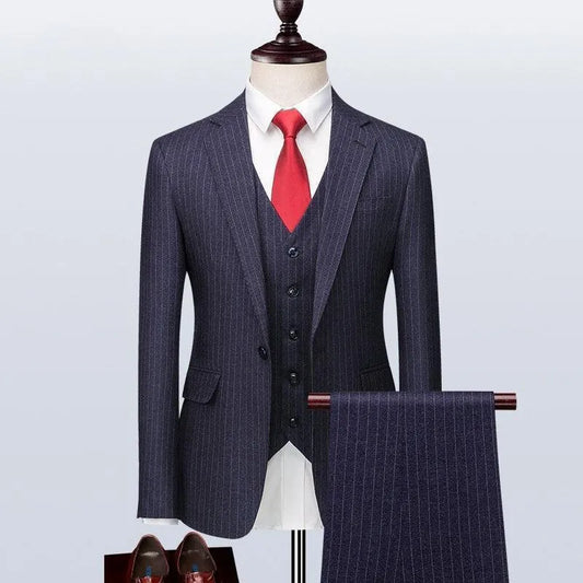 Men's navy pinstripe three-piece suit with red tie on mannequin