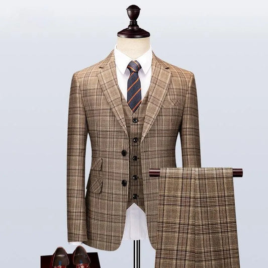 Brown plaid three-piece men's suit with tie on mannequin, matching trousers displayed