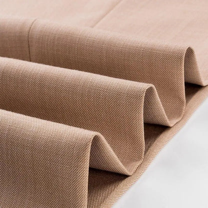 Close-up of folded camel suit fabric with textured weave, ideal for men's 3-piece suit.