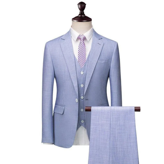 Light blue men's 3-piece suit with striped tie on mannequin, dress pants displayed