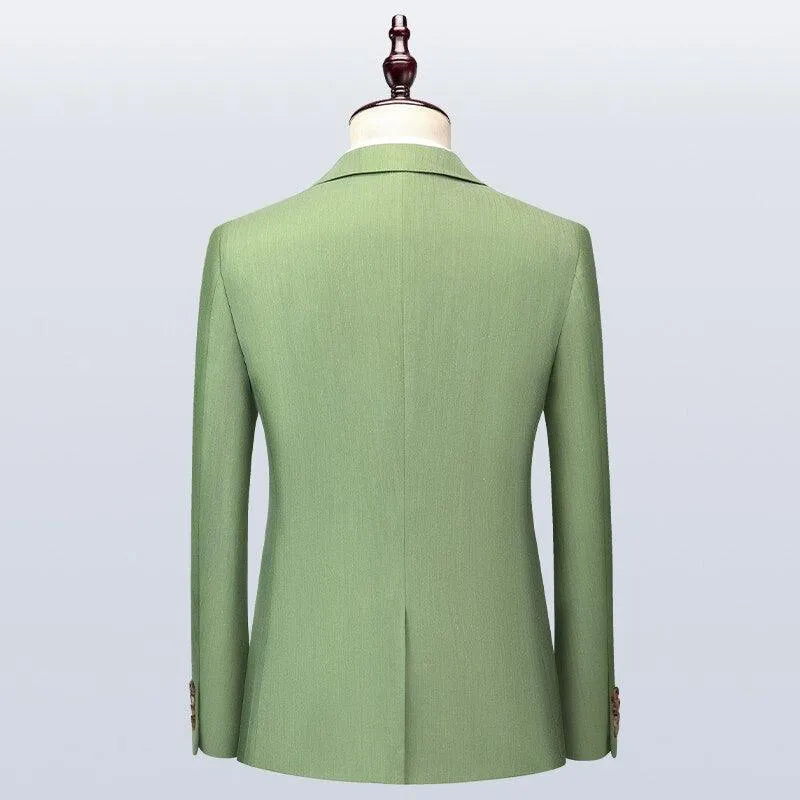 Back view of a green men's suit jacket on mannequin against plain background