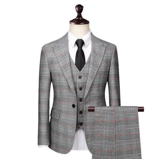Gray plaid three-piece men's suit with white shirt and black tie on mannequin