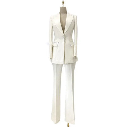 White women's pantsuit with blazer and flare trousers on mannequin, elegant formal suit