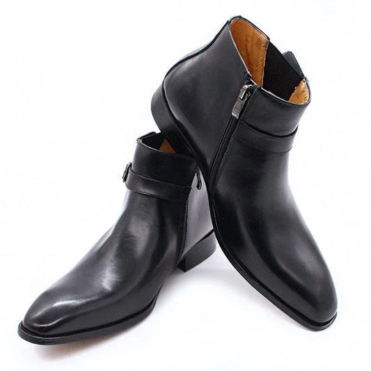 Black leather ankle boots with side zipper and buckle on white background