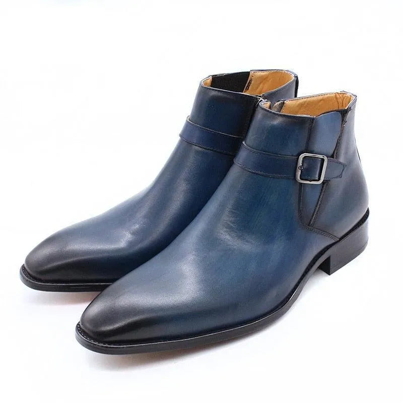 Blue leather ankle boots with buckle detail and low heel on white background