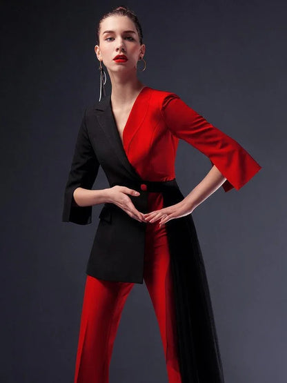 Woman in a red and black pantsuit with detachable veil, fashion studio shot