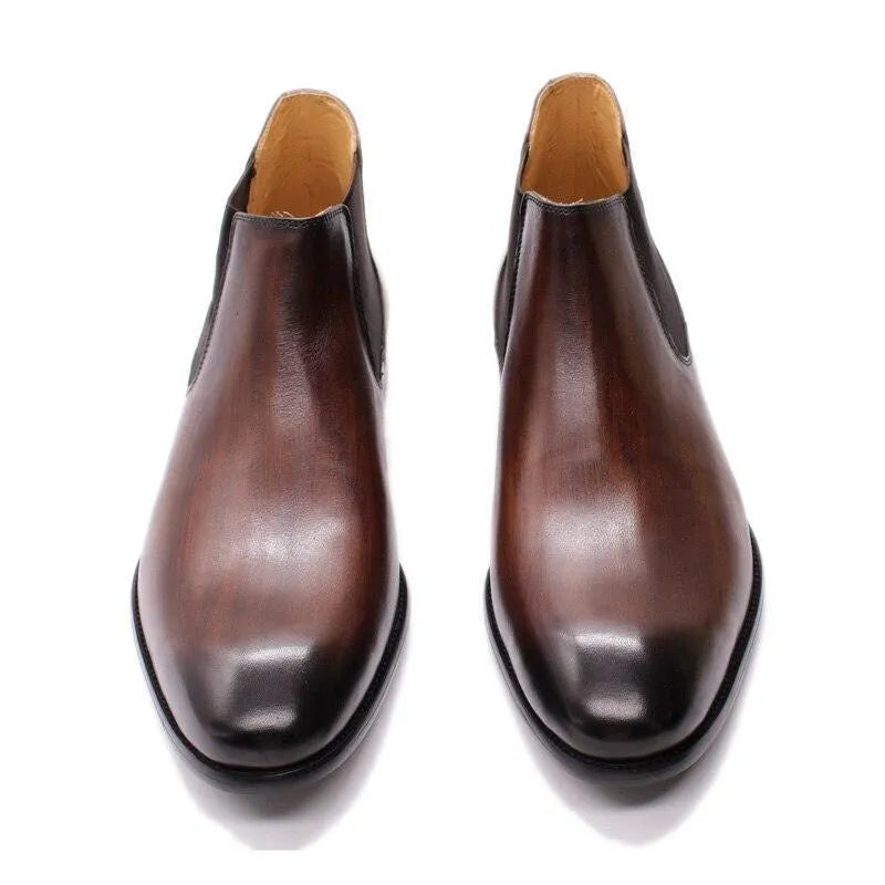 Brown leather ankle dress boots with polished finish on a white background