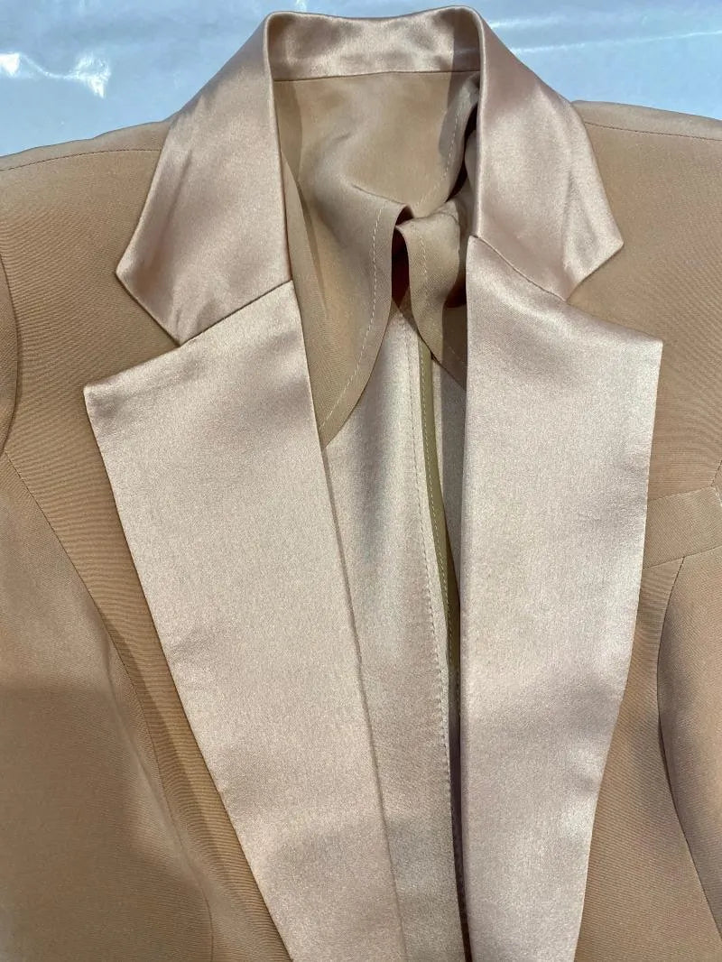 Champagne silk satin wedding pantsuit jacket with wide lapels, close-up view