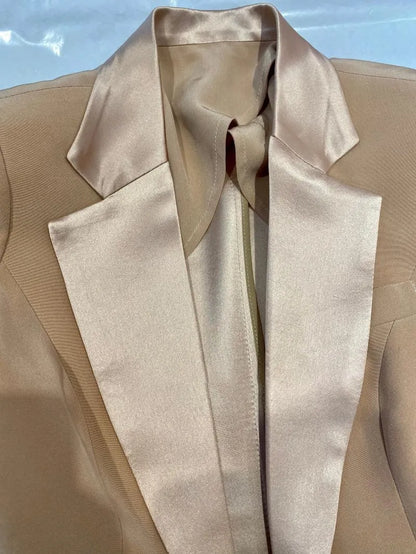 Champagne silk satin wedding pantsuit jacket with wide lapels, close-up view
