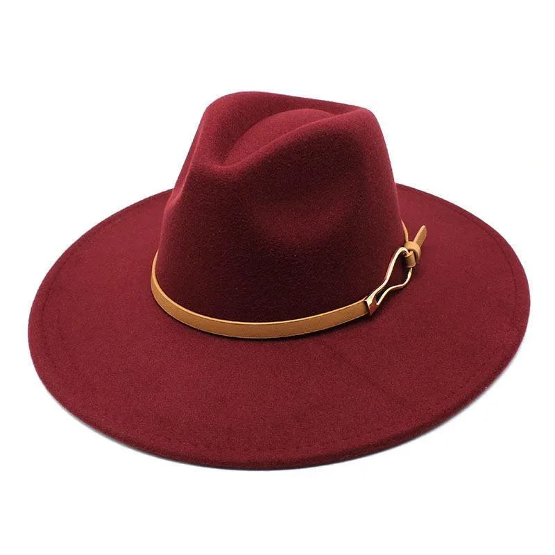 Burgundy unisex felt fedora hat with wide brim and brown band, isolated on white