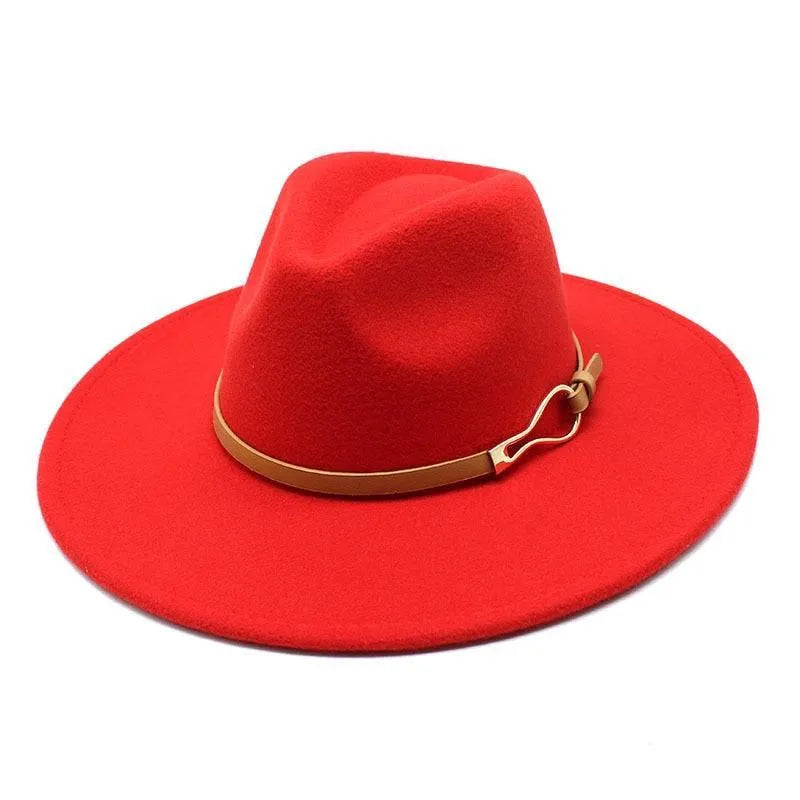 Red unisex felt fedora jazz hat with wide brim and tan band on white background