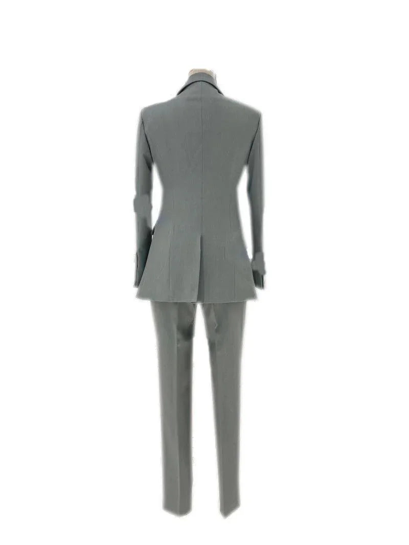 Back view of women's elegant grey trouser suit set with blazer and pants on mannequin